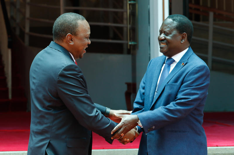 Raila and Uhuru shaking hands